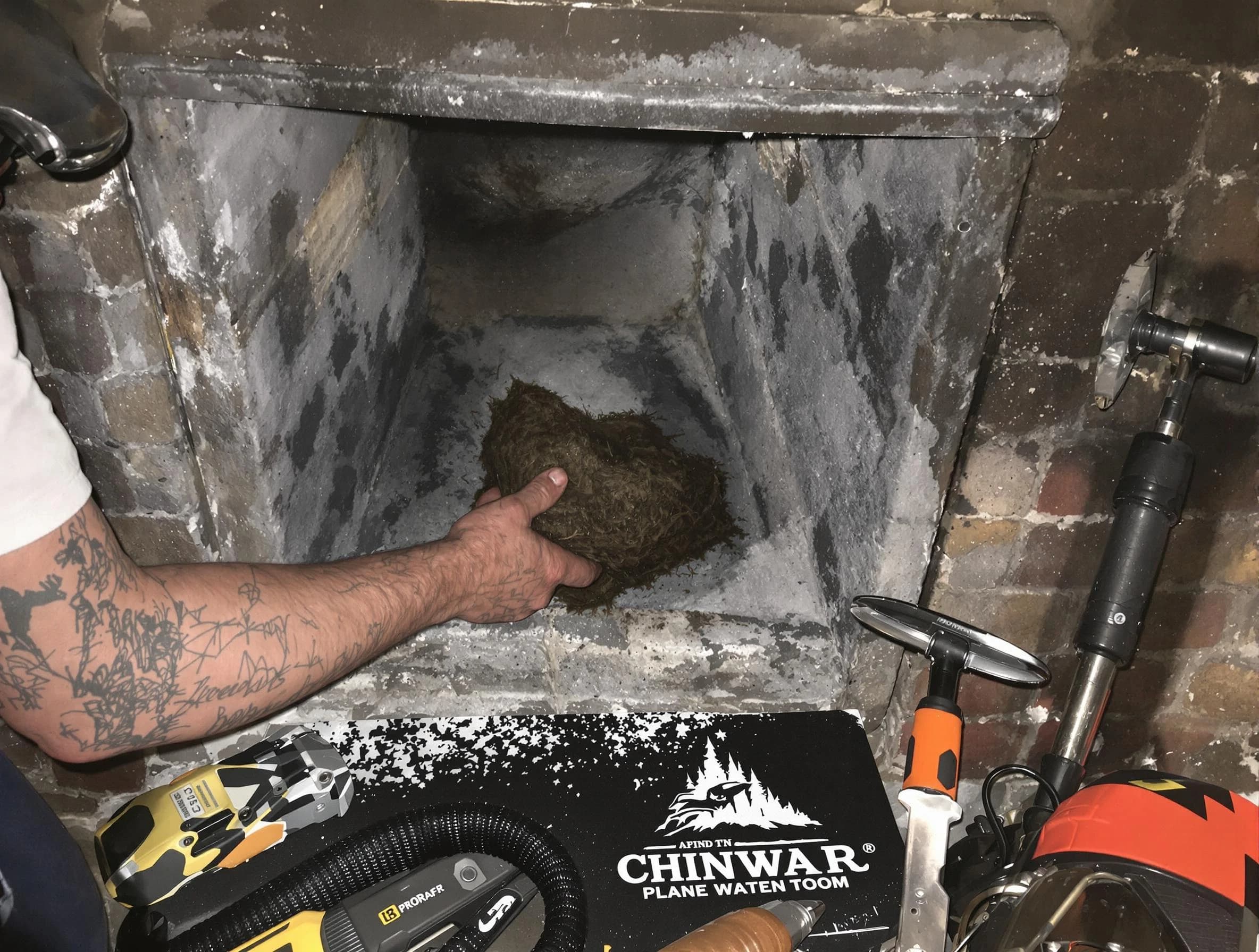 Bridgewater Chimney Sweep safely removing debris and screening chimney in Bridgewater, MA